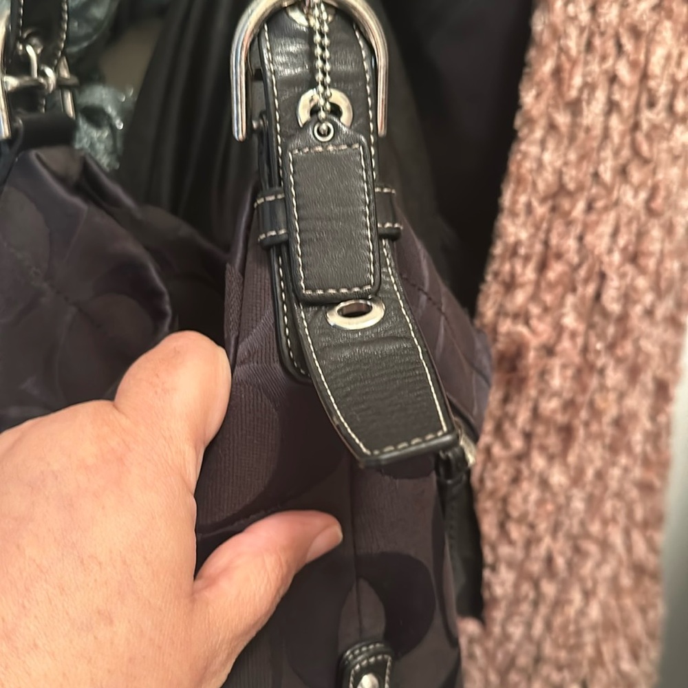 Coach black woman hand bag. Adjustable straps.